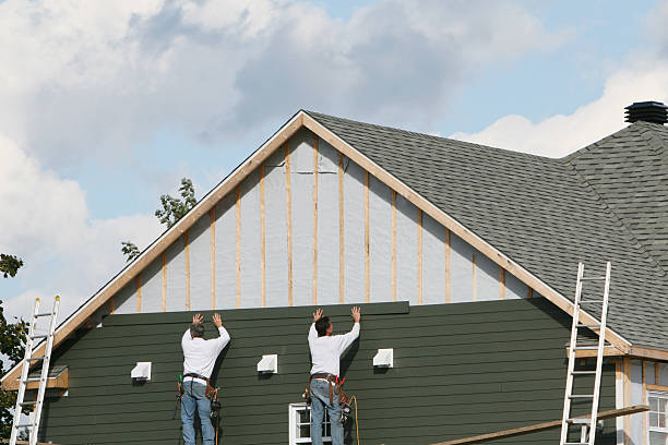 Professional Storm Damage Siding Repair technician working in Hastings, FL